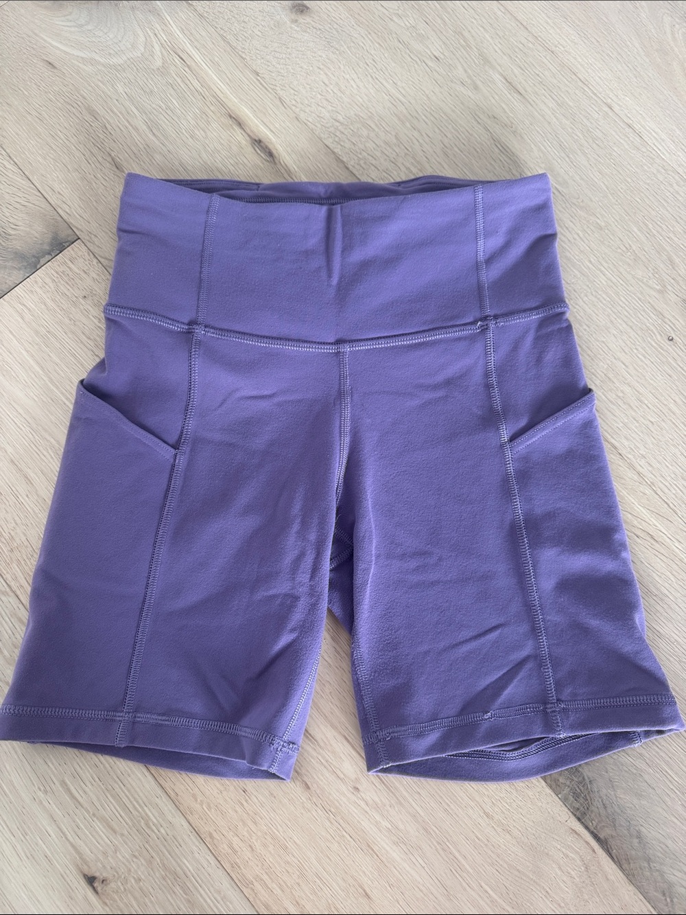TNA Women’s High-Rise Purple Bike Shorts with Side Pockets